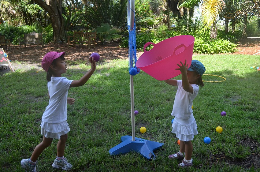 Alli and Anna Kim play together.