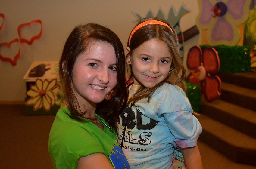 Abby Daunt and Anna Inverso take a break from dancing.