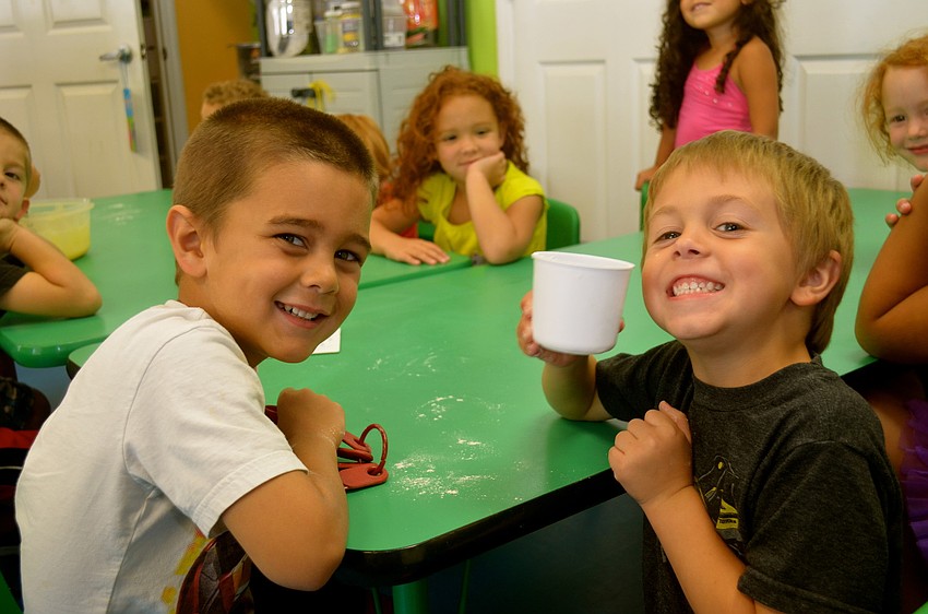Brayden Jacobs and Kaiden Kulchar help gather baking supplies.