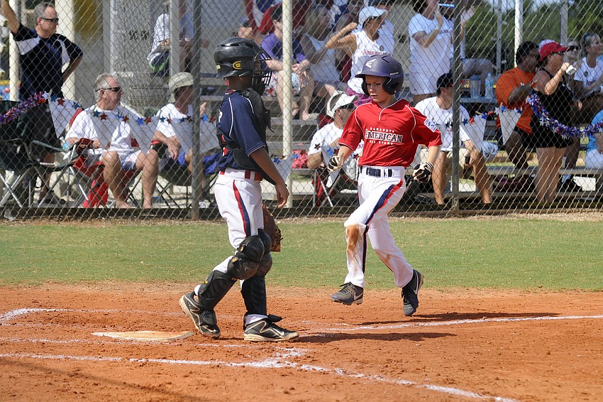 Austin Harford scored a run for the Sarasota American 9/10 All-Stars in their tournament opener versus Sarasota National.