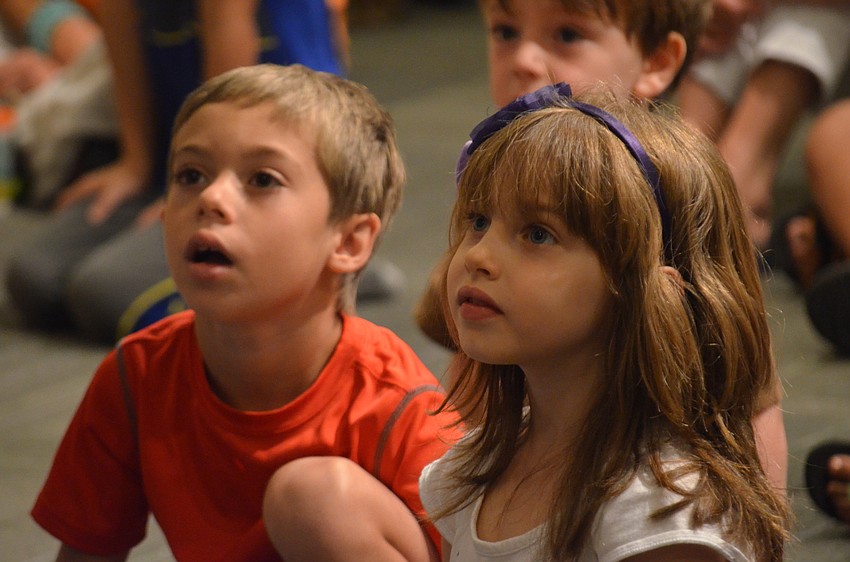 Jordan Formica and Marti Ann Entler listen to the presentation.