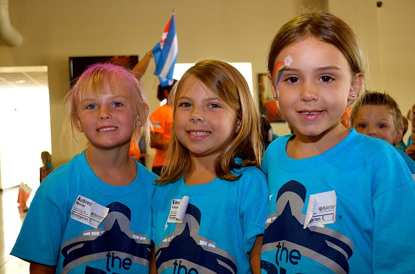 Aubrey Mohler, Emerson Lepper and Kelsey Jerome wear matching shirts and smiles.