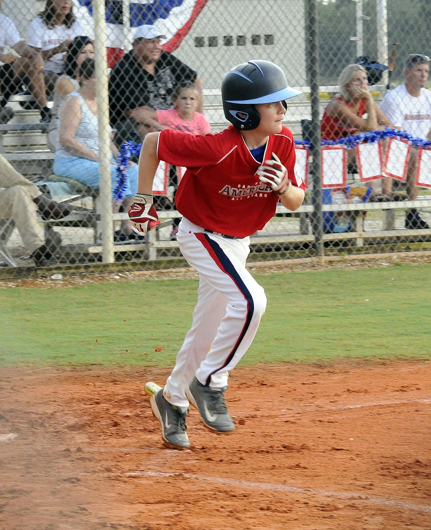 Shortstop Jimmy Hazlett heads for first base after hitting a ground ball in his first at bat.