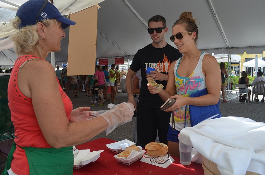 Conor and Mara Foley buy some lobster bisque from Abby Bieter.