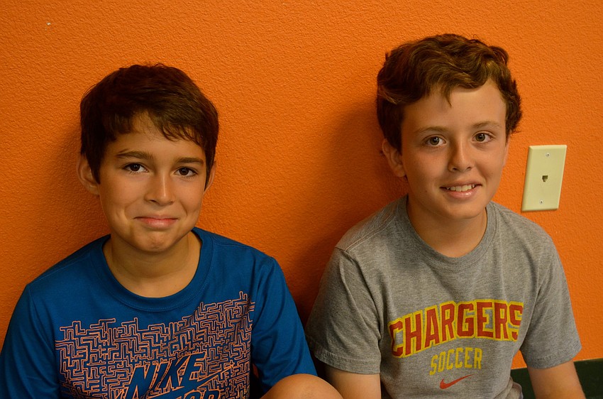 Kevin Caceres and Daniel Hernandez take a break from game time.