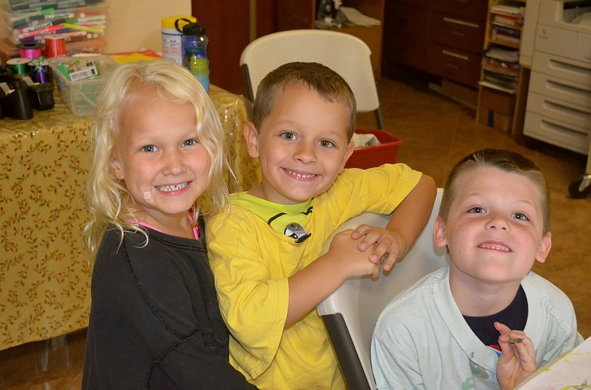 Natalie Franz, Gavin Peterson and Christian Buchanan enjoy craft time.