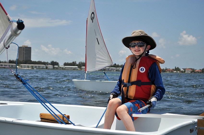 Sarasota Youth Sailing Programâ€™s summer sailing camp students sail optiâ€™s through Sarasota Bay.