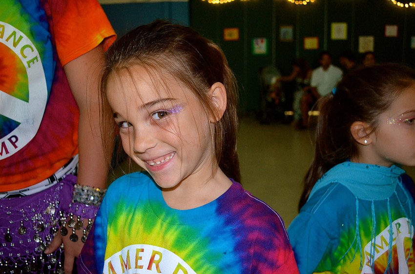 Grace Hroncich relaxes before the next dance routine.