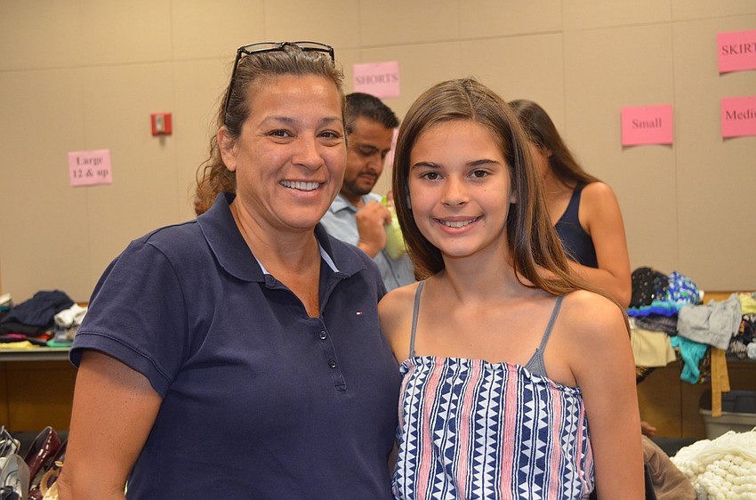 Norma and Jeanni Castro shop before the fashion show.