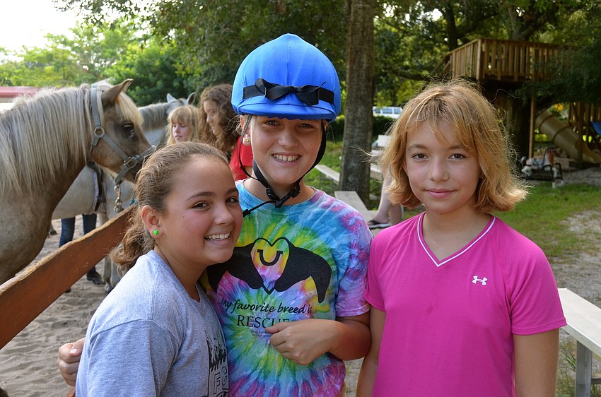 Gabby Flores, Rachel Crisp and Anya Kratz enjoy time outside.