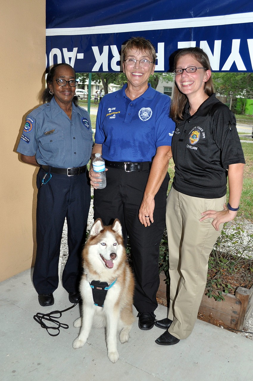 Dot Jones, Kim Aschwanden and Vikki Burton with Kira the husky