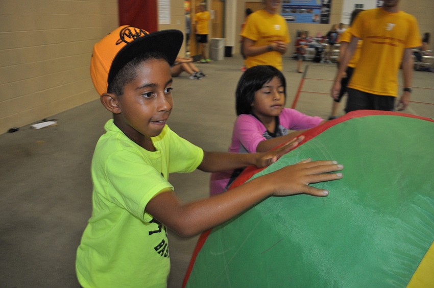 Louis Hodo moves the giant beach ball.
