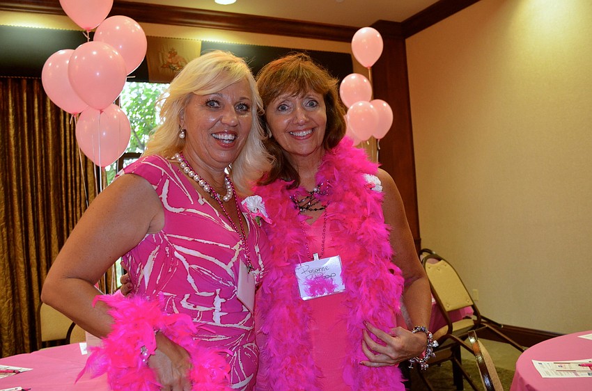 Wanda Martinetto and Roseanne Raap are dressed to impress, with their pink outfits.