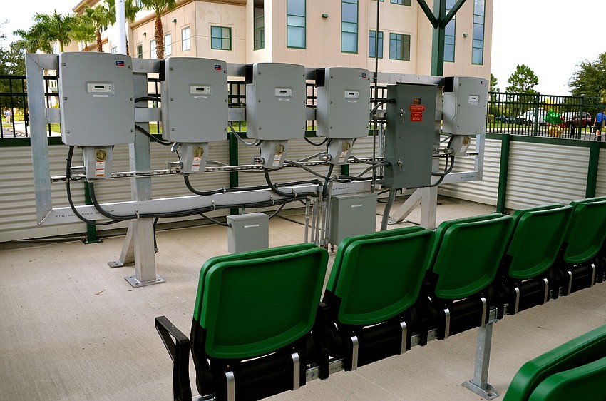 The outdoor solar energy teaching lab features two rows of seating for a show-and-tell atmosphere.