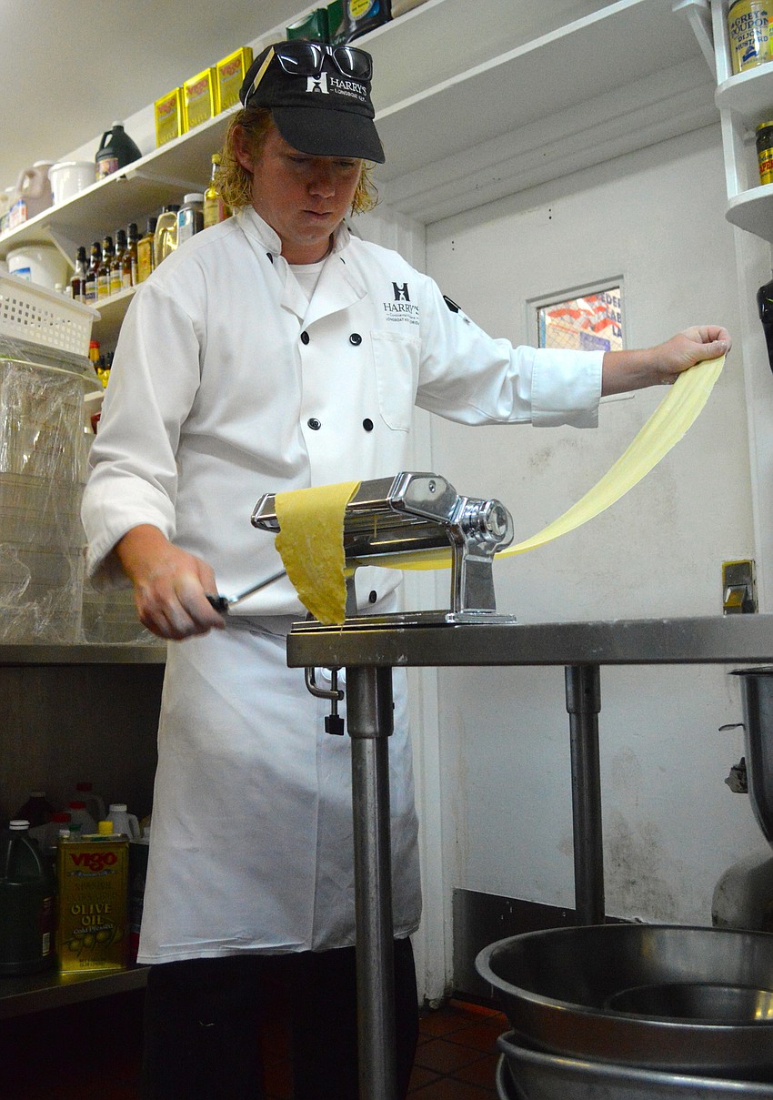 Executive chef Ian Clark makes pasta at Harryâ€™s Continental Kitchens. Clark started at Harryâ€™s eight years ago as a dishwasher on an internship before becoming head of the kitchen.