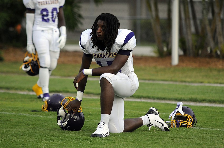 Booker defensive end Dâ€™Andre Bass prepares to take the field against Sarasota in the Tornadoes season opener Aug. 29.
