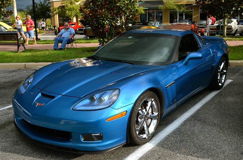 Local residents display their classic and newer-modeled cars before the storm hit.