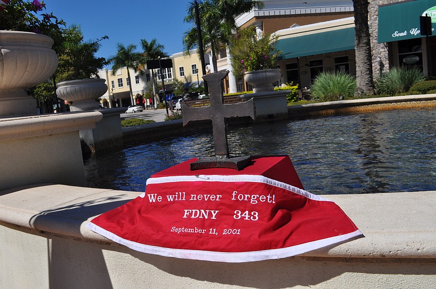 Retired New York firefighter Robert Korfman, of the Marine 1 unit, placed his cross made of steel from a Trade Center beam at the front of the ceremony site.