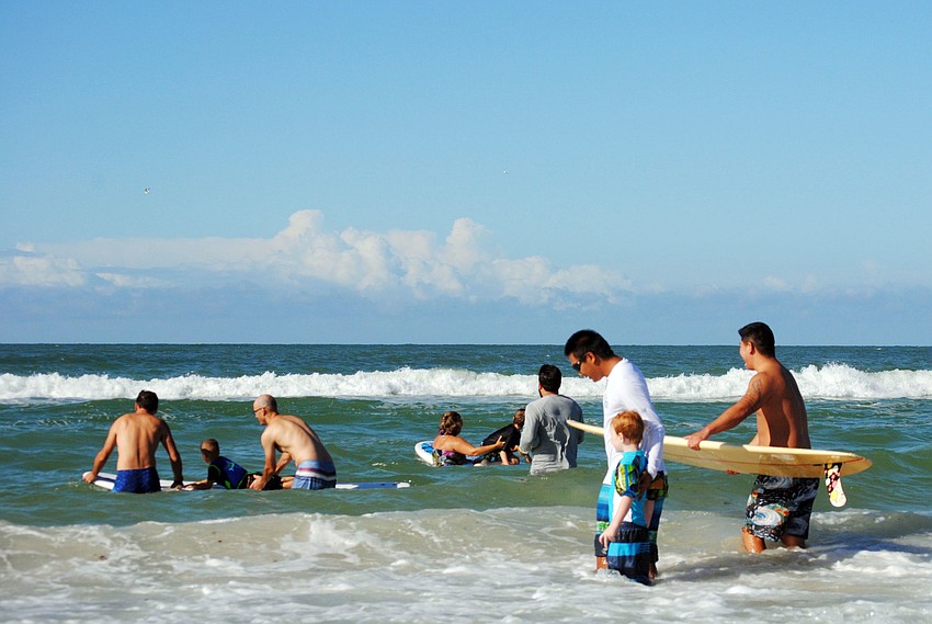 Hundreds gather on Siesta Key Beach for the 5th annual Hang Ten For Autism surfing event.