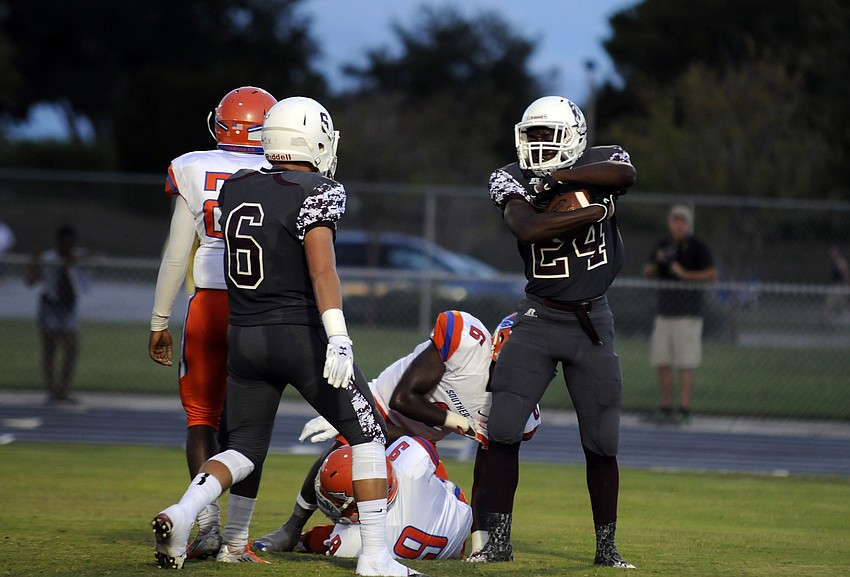 Braden River running back Carlos Crawford celebrates following his 15-yard touchdown run in the first quarter.