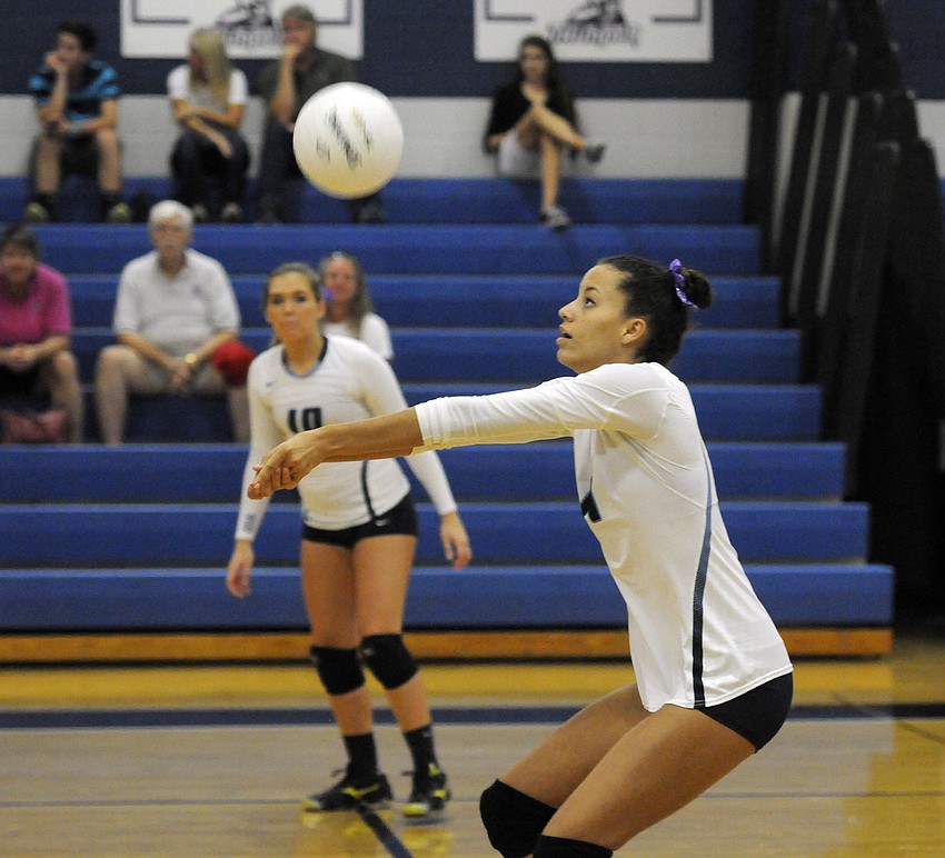 Senior Reanna Gregory passes the ball back up to a teammate.