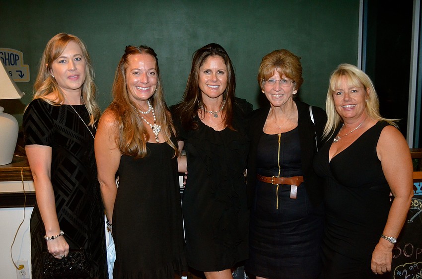 Shelley Jones, Sonia Klauber, Charlotte Tuyo, Annette Royster and Kim Earley show off their black dresses.