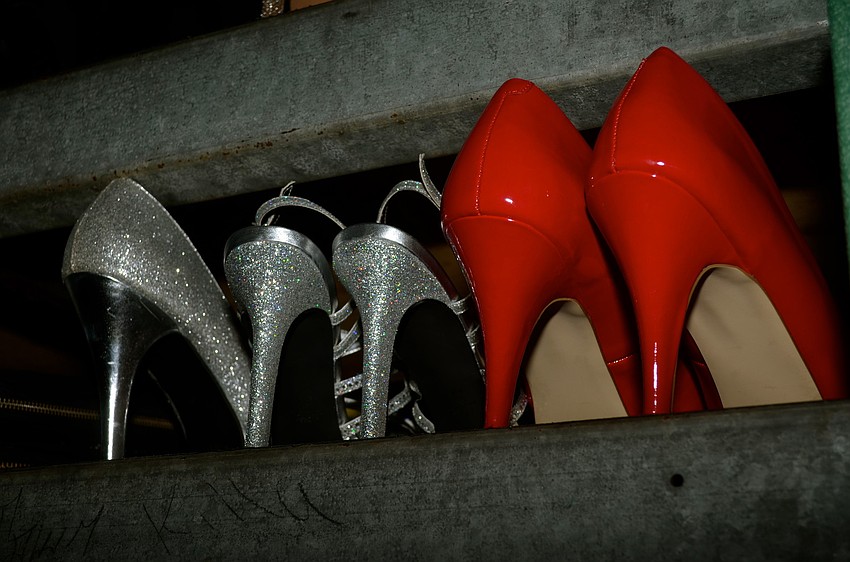 The girls leave their heels and dance with bare feet.