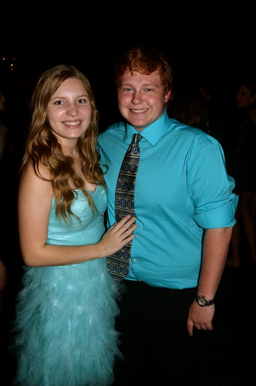 Kaley Tyler and her date, Grant Haas, wear matching formal wear.