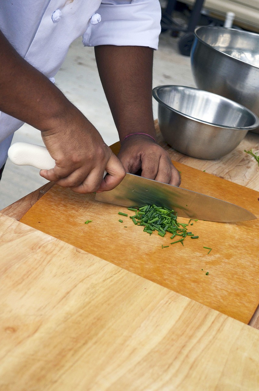 Chef Jose Martinez prepping food for lunch at Sweetgrass Farms.