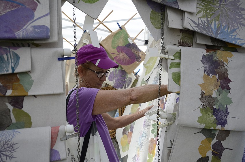 Gail Blesoe, a Texas resident, came to the market while she was in Sarasota. She purchased some of vendor Pat Webber's nature print table runners at the Farmhouse Market.