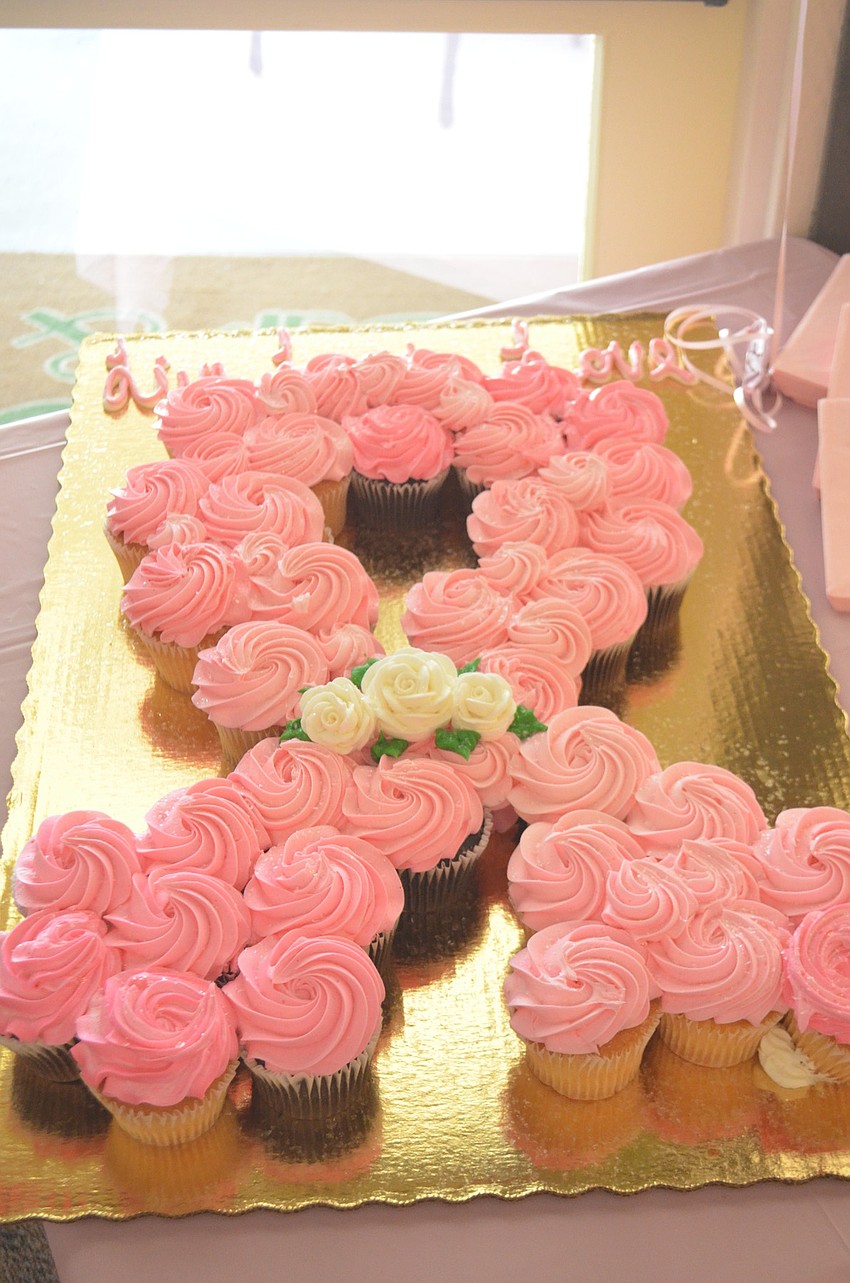 The banquet served cupcakes that were created in the shape of a pink ribbon â€” a commonly recognized breast cancer symbol.