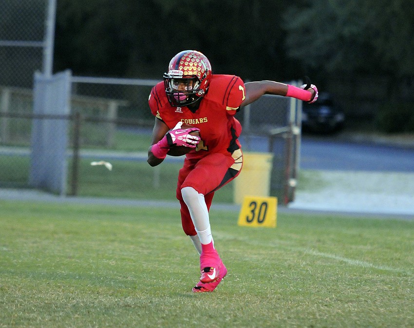 Senior Blair Perry returns a punt in a first quarter.