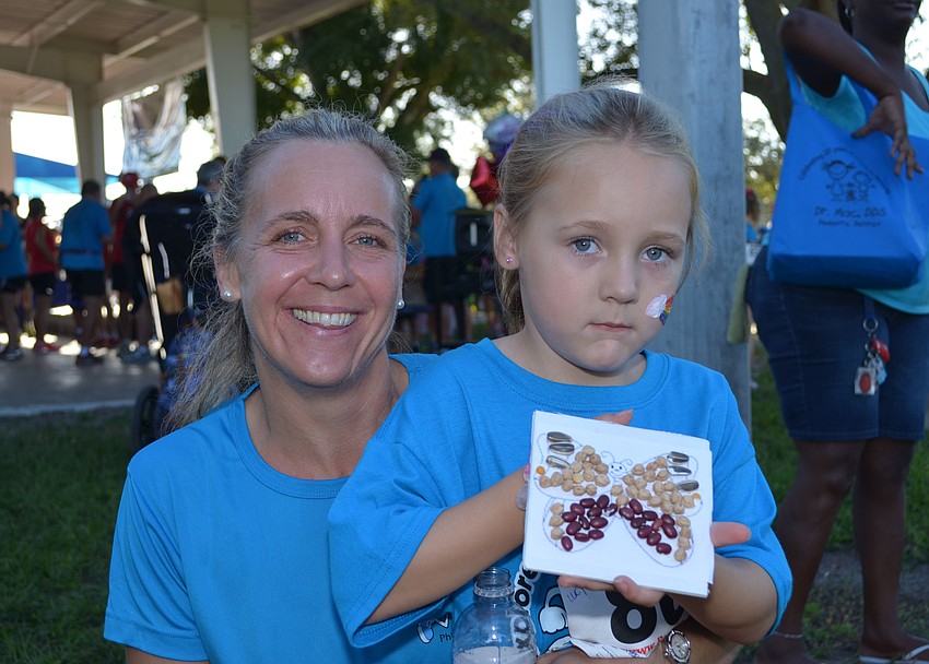 Bailey Lowther and her daughter Lucie attend the Phillippi Shores Elementary 7K Run.
