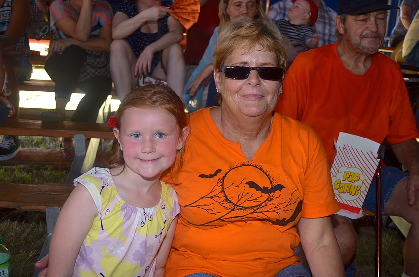 Reese Whiting and Rhonda Wells wait for the circus act to start.