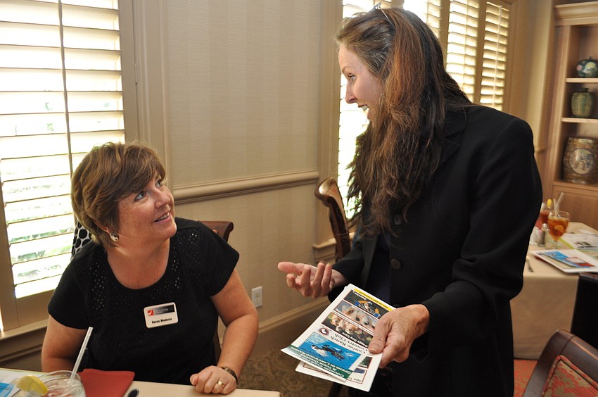 Karen Niederer, of Small Engine Repairs, learns about Heather Perryâ€™s new venture, the Canine Ranch and Country Club.