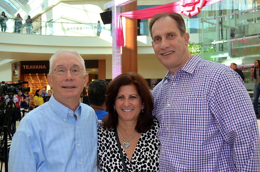 Kevin Kinney, Anna Milone and Dennis Madej wait for the ribbon cutting ceremony.