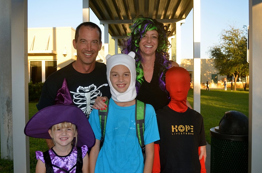 The Van Nortwick family â€” Craig, Angela, Zach, Troy and Claire â€” show off a range of costumes.