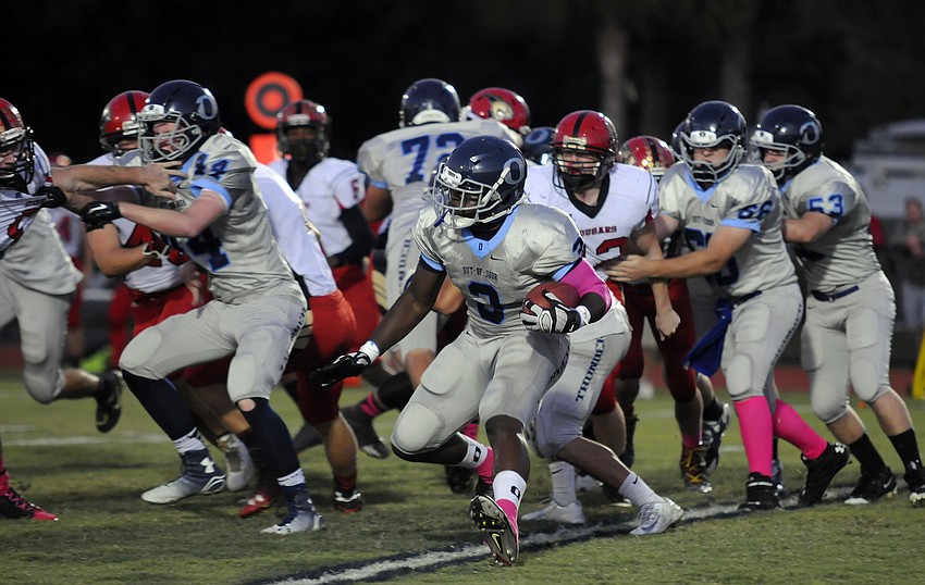 ODA running back Najee Rhodes carries the ball for the Thunder on its opening possession.