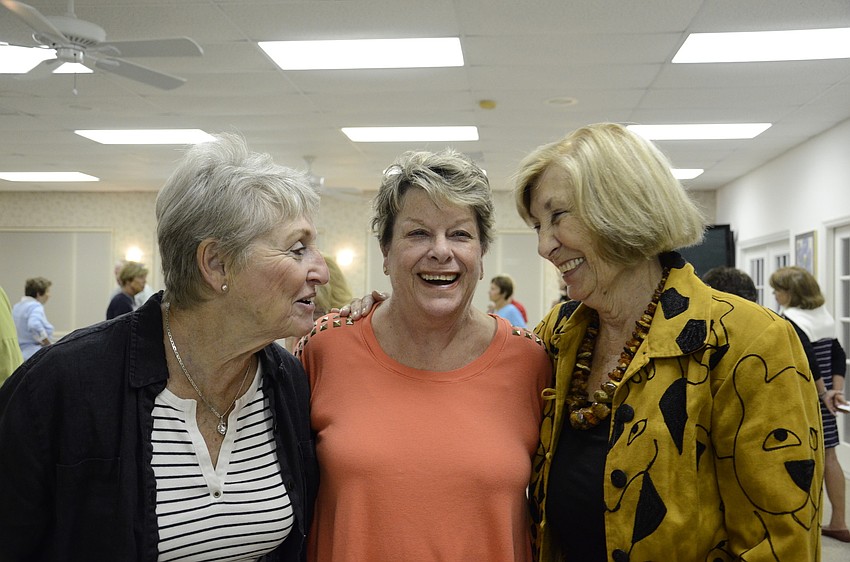 New member Roz Lurie, left, laughs with Barb Kerwin, middle, and Jinny Johnson, right, before posing for a picture.