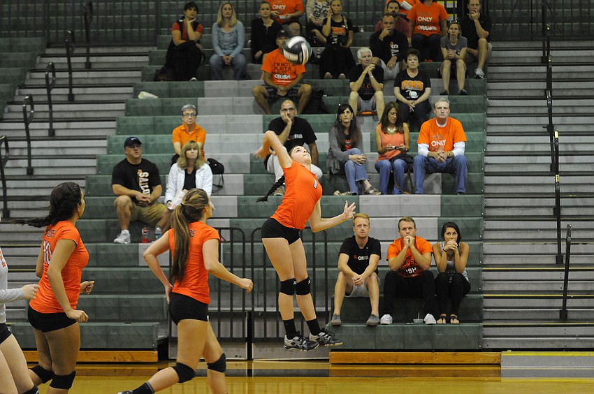 Sarasota senior outside hitter Jordan Brooks records a kill in the first set.