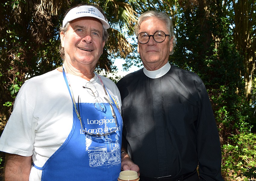 Bill Evanco and Rev. Carroll.  Evanko helped prepare the bratwursts for the meal.