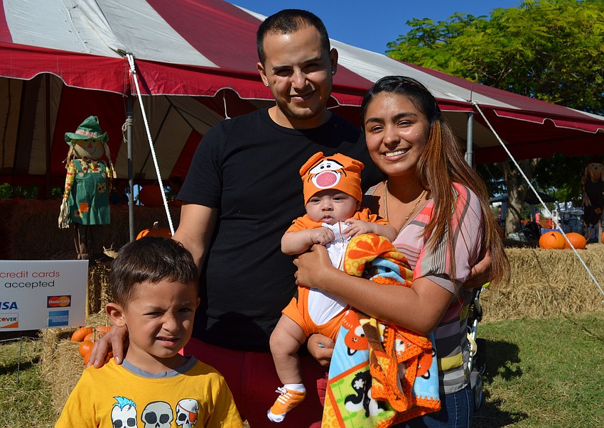 Jayden Camarripa, Alberto Camarripa and Odhet Ortega with her son Angelo after walking through the hay maze.