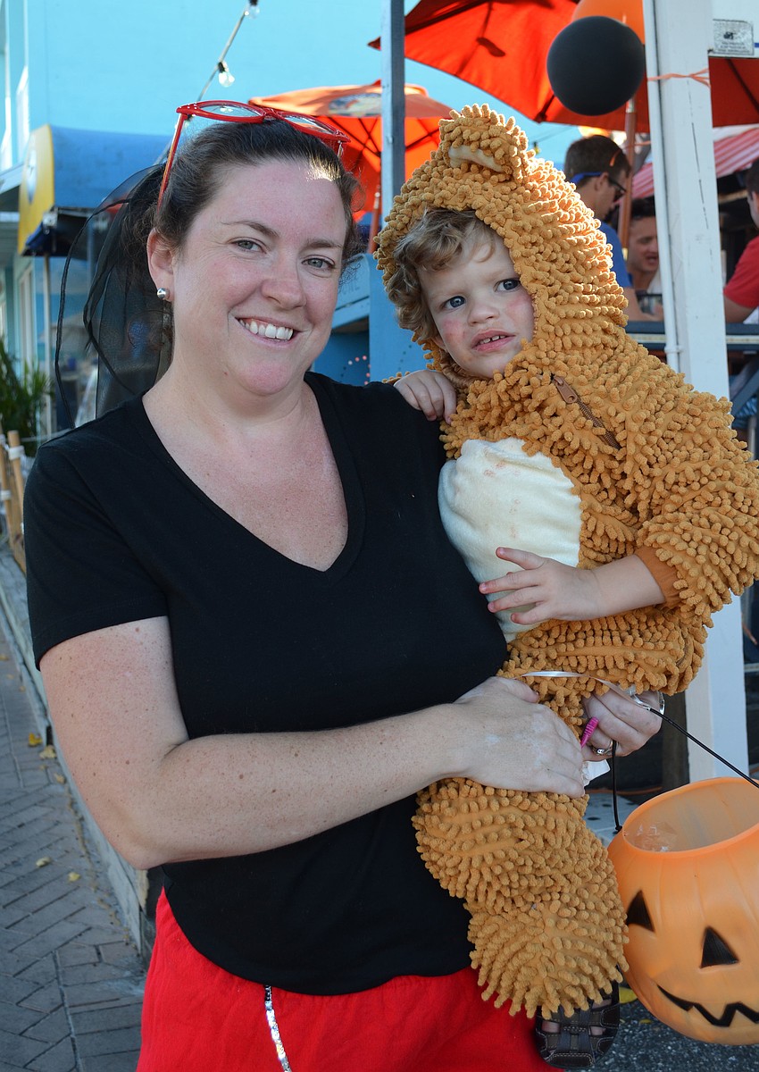 Dawn Hunter and her son Sammy trick-or-treat at Siesta Key Village.