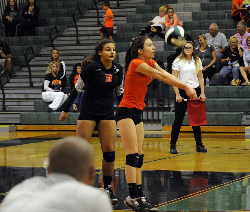 Sarasota senior libero Alexa Lawrence passes the ball back up to a teammate.