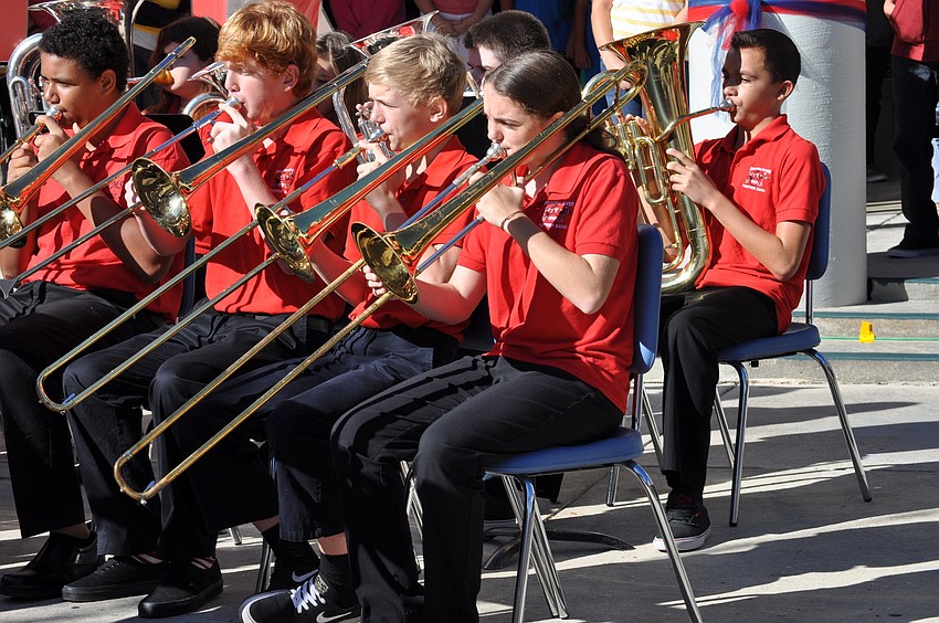 Orchestra students play a patriotic song.