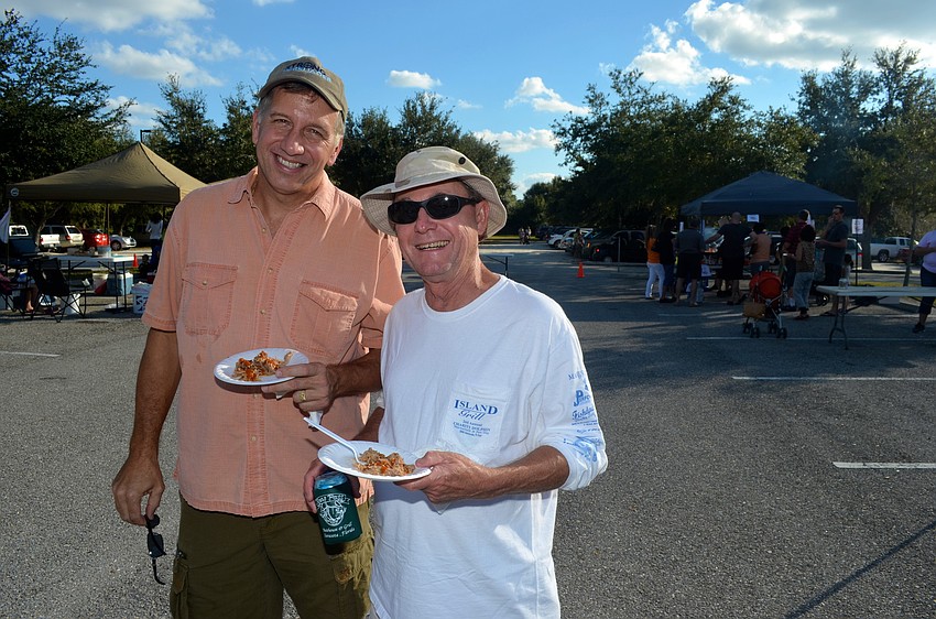 Greg Davis and Al Harcharik sample the day's offerings.