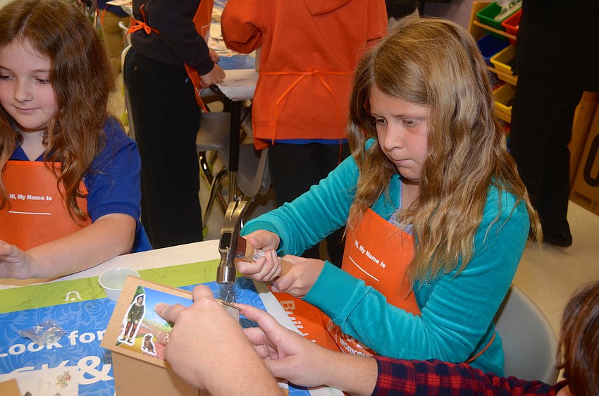 Madi Hogan is almost done crafting her birdhouse.