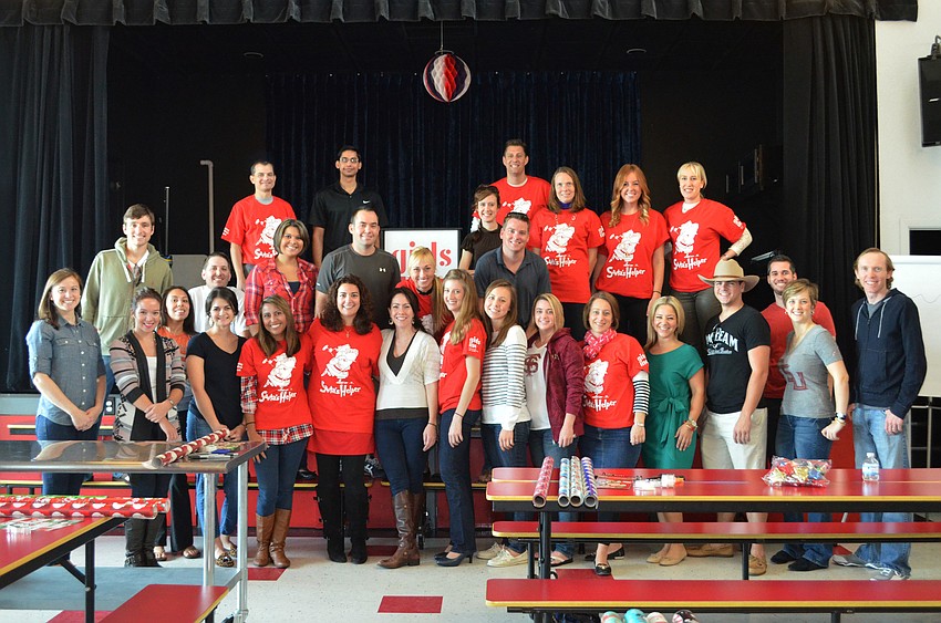 Members of the Sarasota Young Professionals Group pitched in to help wrap gifts at Girls Incorporated.