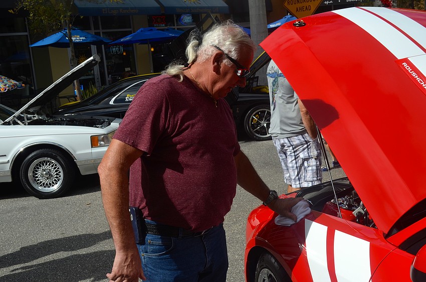 Gary King polishes off his 2009 Roush Mustang.