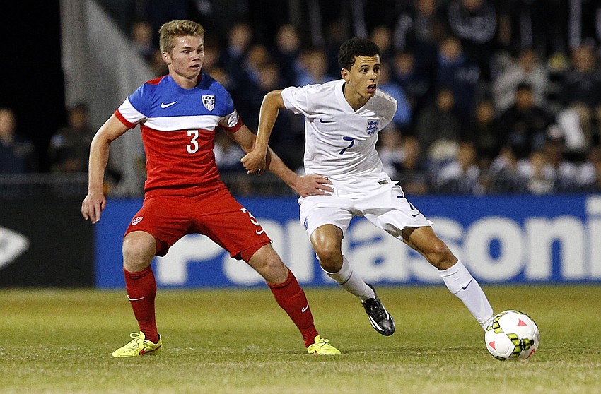 U.S. defender John Nelson battles Englandâ€™s Nathan Holland for possession in the first half.